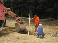 [During Construction] Construction crew digs one of two infiltration trenches.