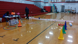 A gymnasium with various games set up