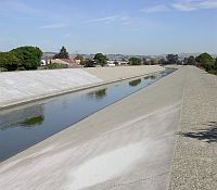 Photo showing how overflow areas are built into urban areas to move large amounts of rain water or melt with possibly less erosion.