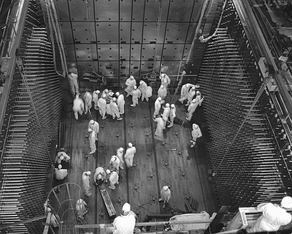 Workers laying graphite blocks in C Reactor in 1952. 