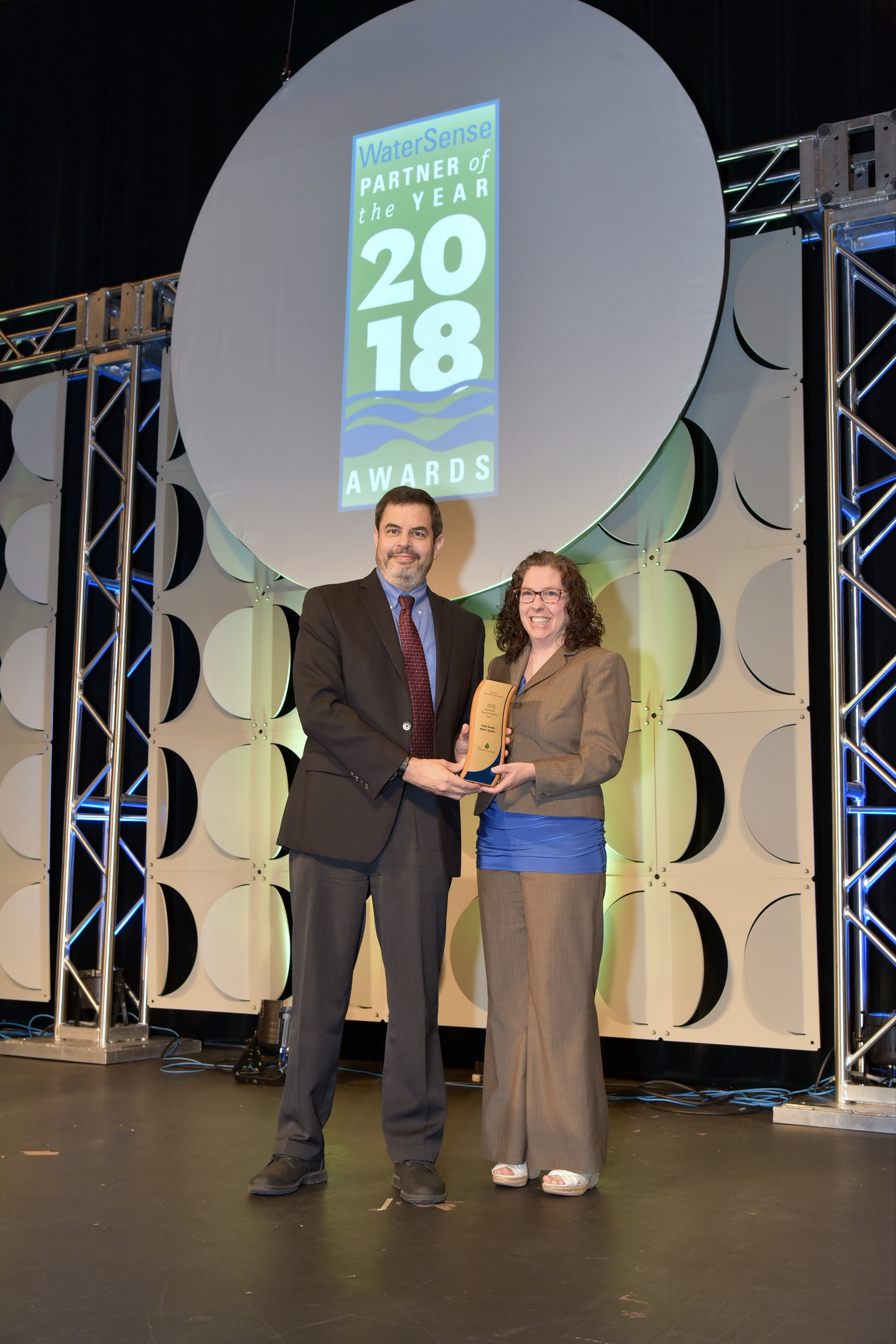 Kathy Nguyen accepts Sustained Excellence Award for Cobb County Water System.