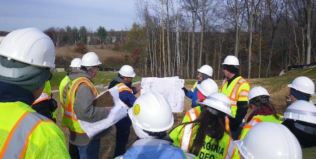 County employees wearing hardhats during an outdoor training session