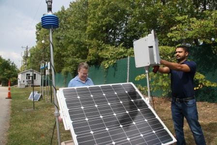 Researchers get air monitors ready for study. 