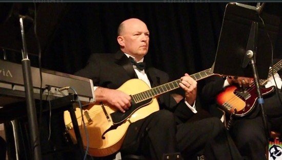 Ian Gilmour performing with his band.