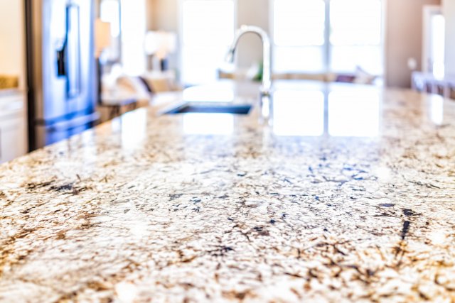 Image of a granite countertop in a kitchen. 