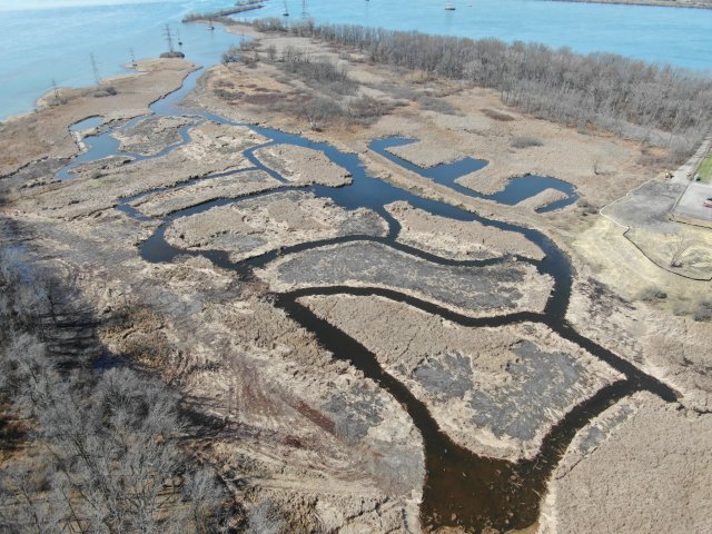 Photo of Channeling, potholing and past dredging work in the Burnt Ship Creek is shown from an aerial photo. Image courtesy of NYSPRHP.