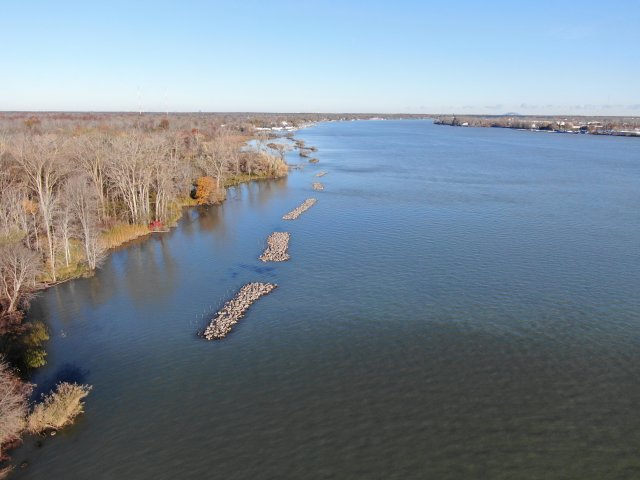 Photo of An aerial view showing the constructed rock reefs protecting the shoreline. Image courtesy of NYSPRHP.