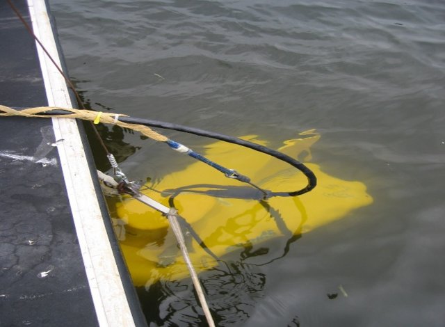 Towfish waterborne seismic system shown deployed in a river