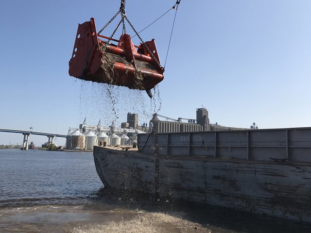 Dredging equipment doing maintenance dredging in the Navigational Channel (Photo Credit: U.S. Army Corp of Engineers