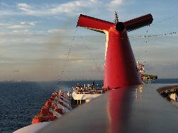 exhaust fumes coming off the tail of a cruise ship