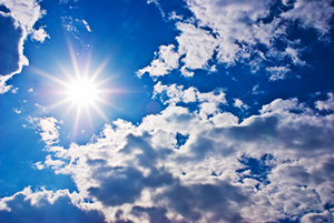 Photo of bright sun and clouds.