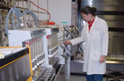 Chemist using soxtherm equipment to peform soil extraction for organic chemical compounds.