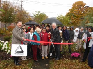 Luis Marin School Outdoor Classroom: Neighborhood Environmental Demonstration Site Ribbon Cutting Ceremony (Richard Tiani, Groundwork and Stacey Johnson-Pridgeon, EPA hold the ribbon as Mayor Bill Finch cuts it, Luis Marin School Associate Principal Olga 