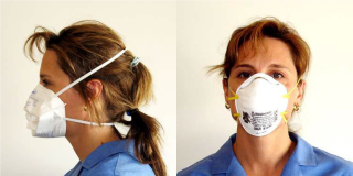 Side and front view of woman wearing two different types of N95 disposable filtering facepiece respirators. Both Respirators have two straps that go around the head and are placed above and below the ears.