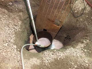 View of liquid treatment chemicals being pumped into the basement sump