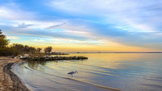 view of a coastline at sunset