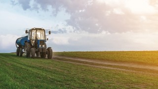 Tractor in a green field