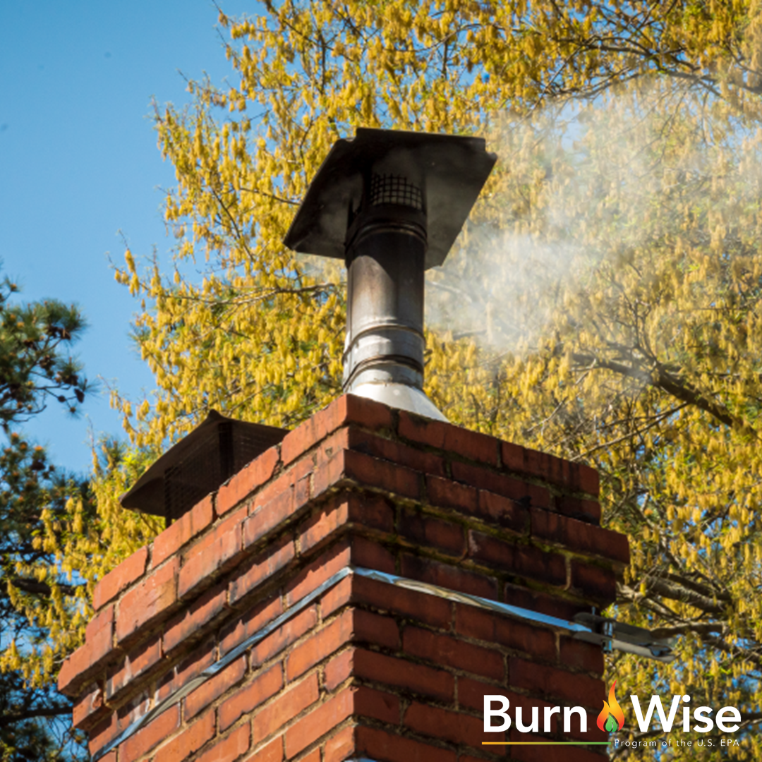 Rooftop with lots of smoke coming out of the chimney