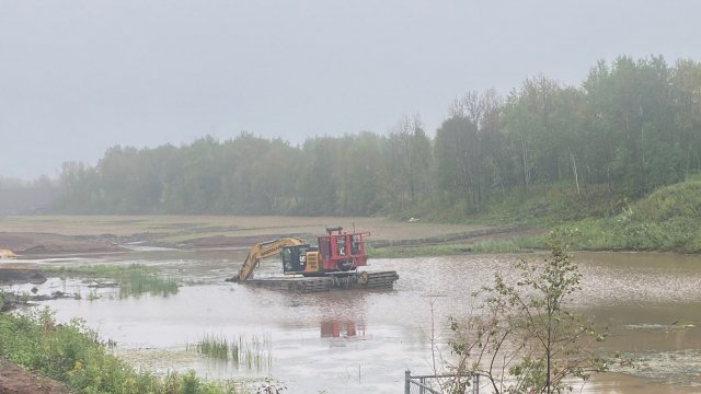 Dredging continues in the Weir Pond. 