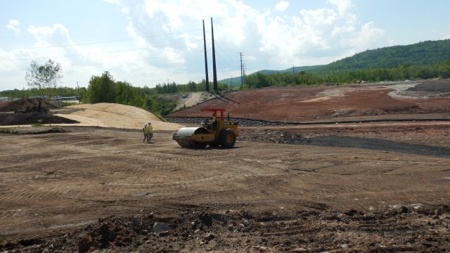 After processing, material from the sediment processing area is placed in the confined disposal facility (CDF) and compacted.