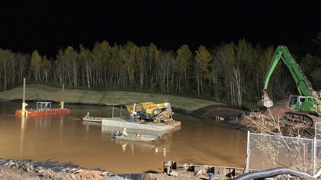 Contractors work 24 hours a day to complete Weir Pond capping. 