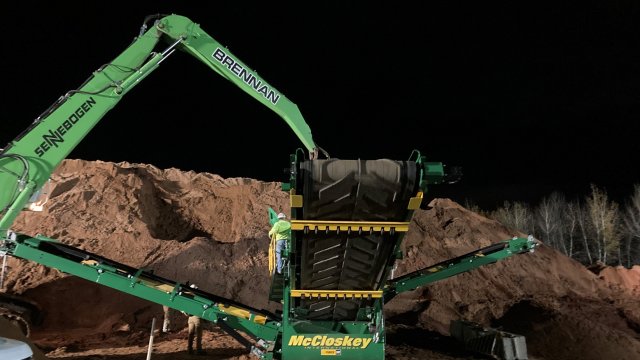 Capping material is loaded into a screener. Contractors continue to work 24 hours a day to complete capping activities. 