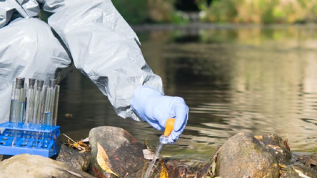 Researcher collecting water samples