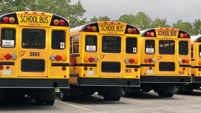 school bus parking lot on cloudy day