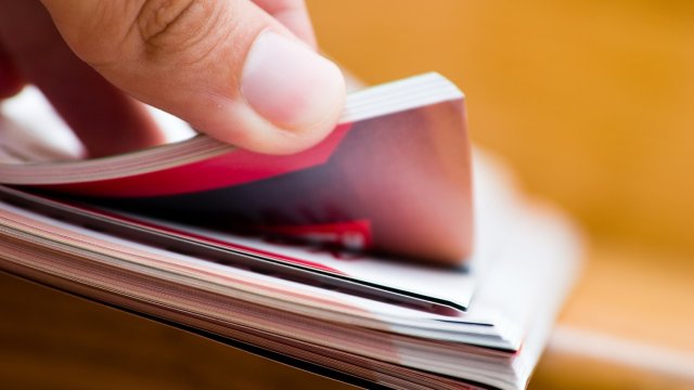 Person thumbing through documents