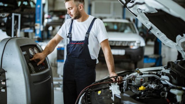 Technician filling AC