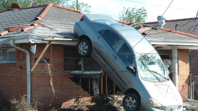 Car on roof after hurricane. 