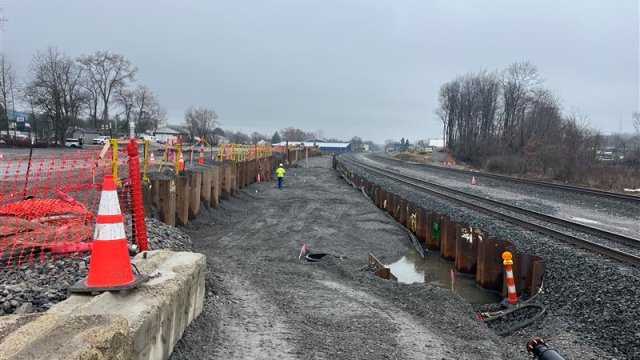 Backfill and restoration in the South Ditch, train tracks to the right.