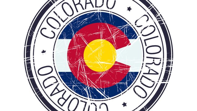 round stamp of the Colorado state flag