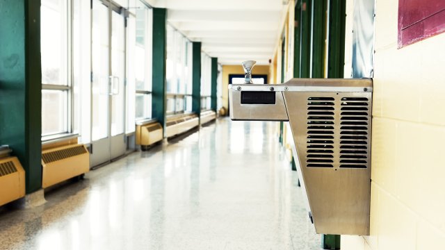 School hallway with water fountain fixed to the right wall.