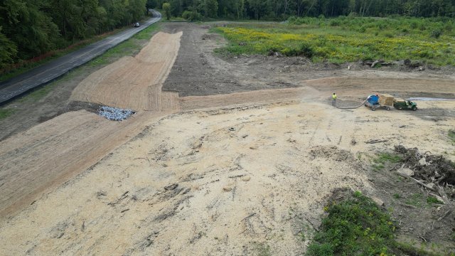 View of the site looking south, contractor hydroseeding the site