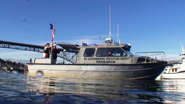 EPA research vessel with diving flags visible taken from perspective of the water's surface.