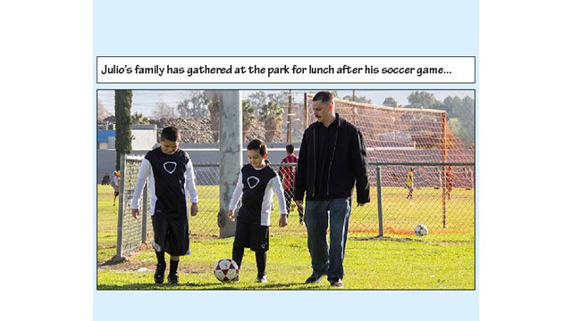 Julio’s family has gathered at the park for lunch after his soccer game. In this picture, Julio, Johnny, and Cesar are kicking a soccer ball around the soccer field at the park.