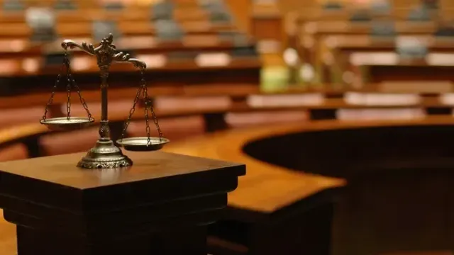 a small balancing scale sitting on a desk