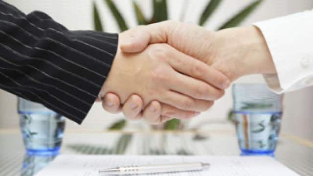 close up of two people shaking hands