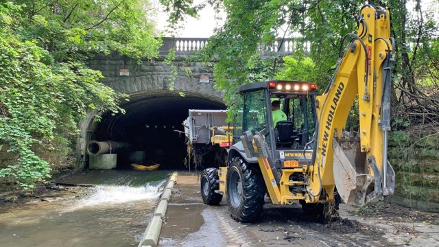 Backhoe with water canal