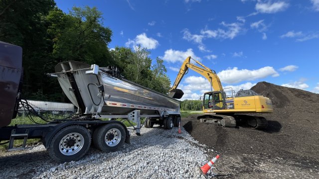 The debris that is being encountered within the river that is not suitable to be mixed with the dredged material is being disposed of at an approved landfill site. 