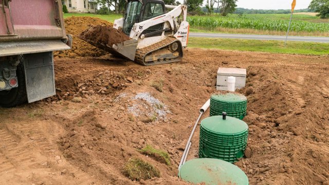 Septic system components exposed