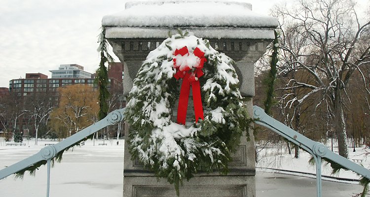 Closeup of holiday wreath on a column of the Boston Public Garden pedestrian footbridge