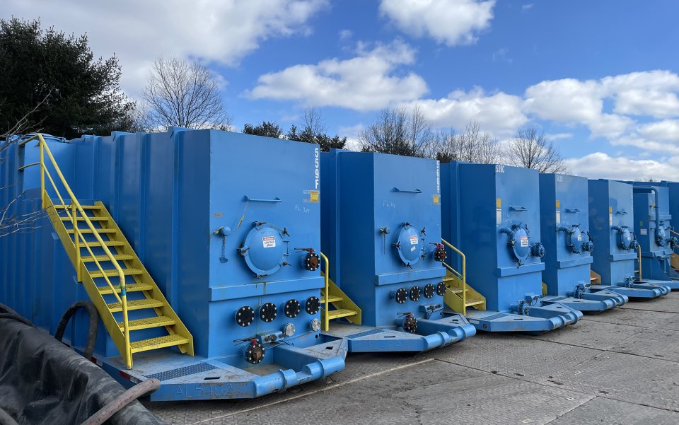 Big blue tanks filled with wastewater