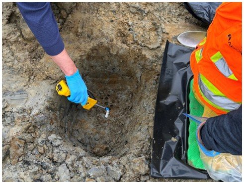 Handheld monitor sampling hole in the ground