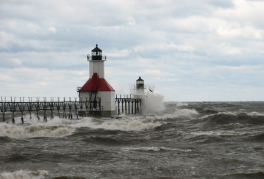 lighthouse with crashing waves 