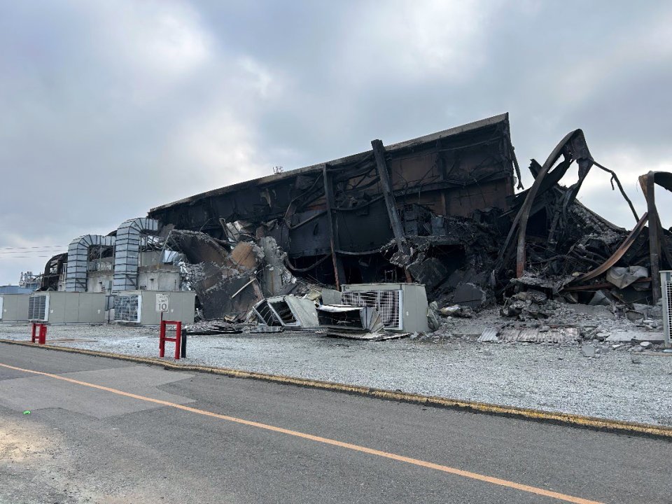 Exterior of structure damaged in fire.