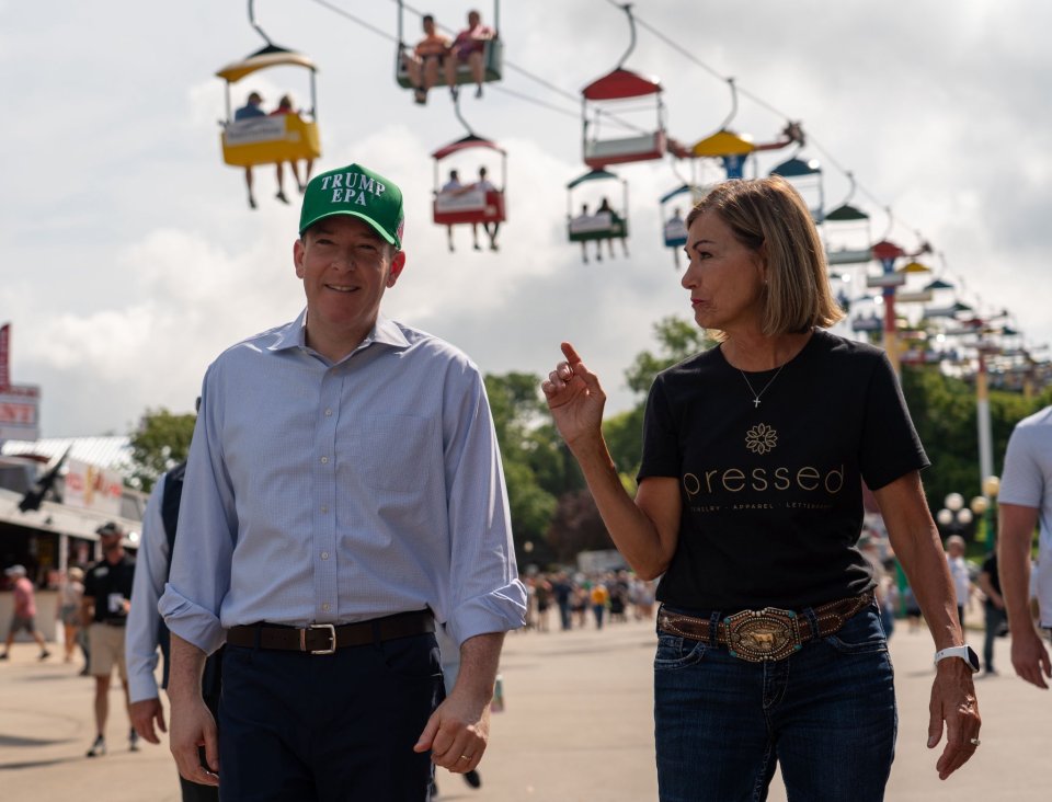 EPA Administrator Lee Zeldin and Iowa Governor Kim Reynolds walk around the Iowa State Fair.