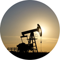 round graphic of oil well silhouette