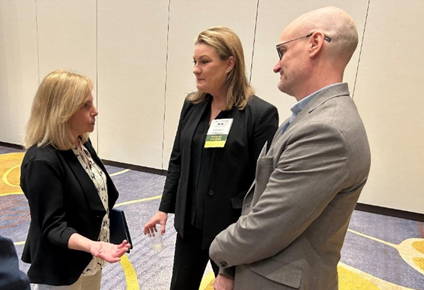Group people of people talking at a conference.